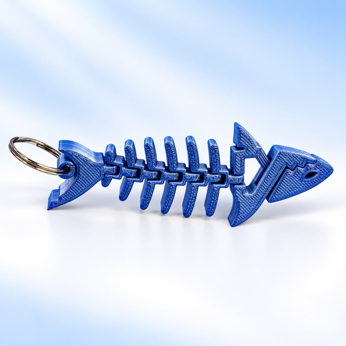 Brelok szkielet ryby 3D – niebieski